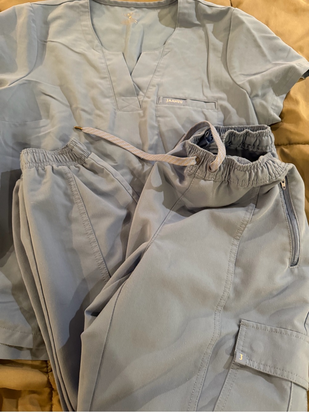 Jaanuu light blue scrub set.